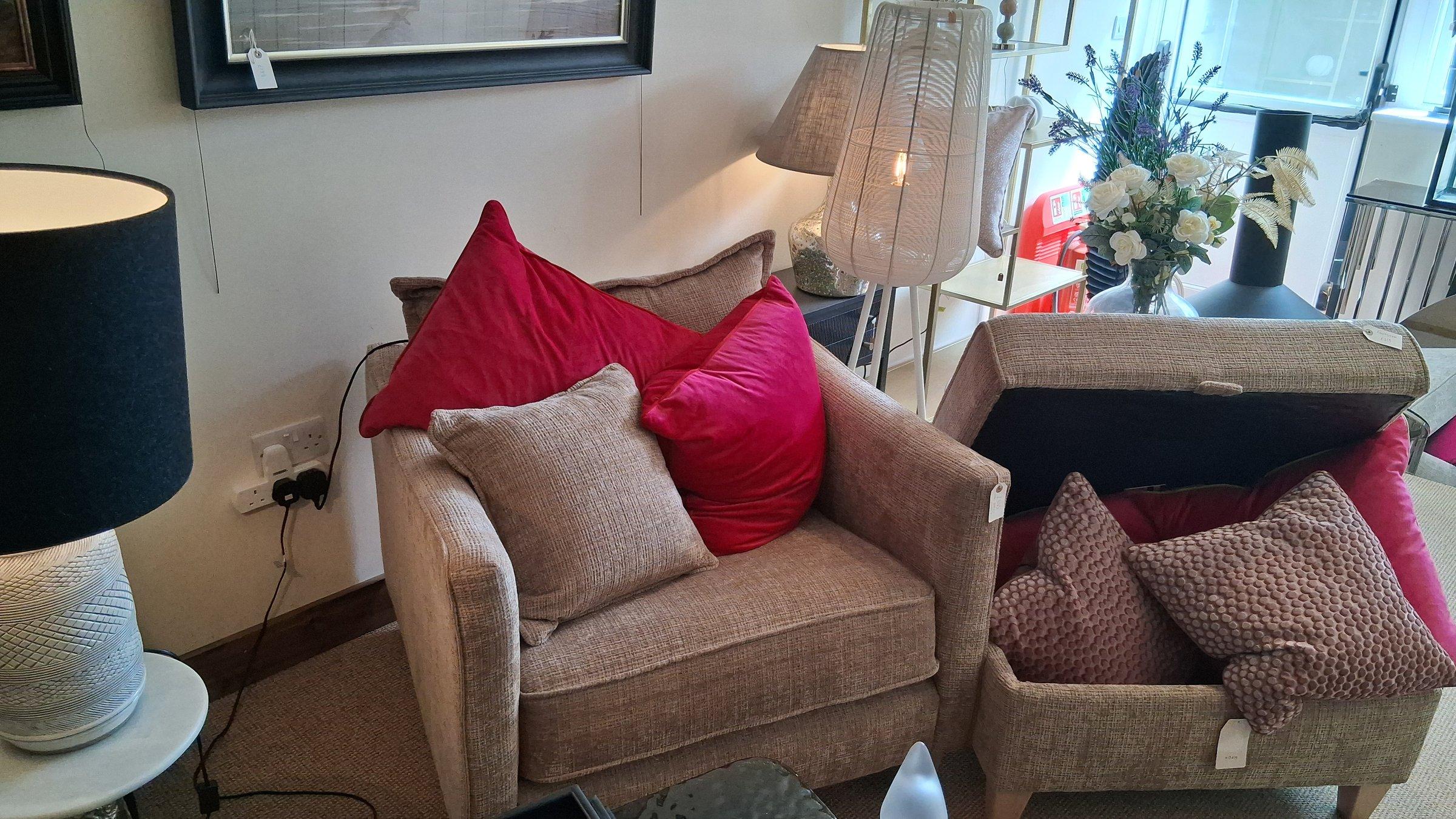 Snuggler armchair styled with cushions and lamps